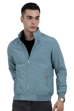 A man wearing an Aqua Blue Finish Lightweight Jacket with high neck collar, zipper closure and pocket in hand designed for casual winter layering and comfort.